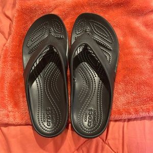 Crocs flip flops.